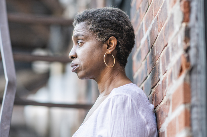 African American woman on fire escape