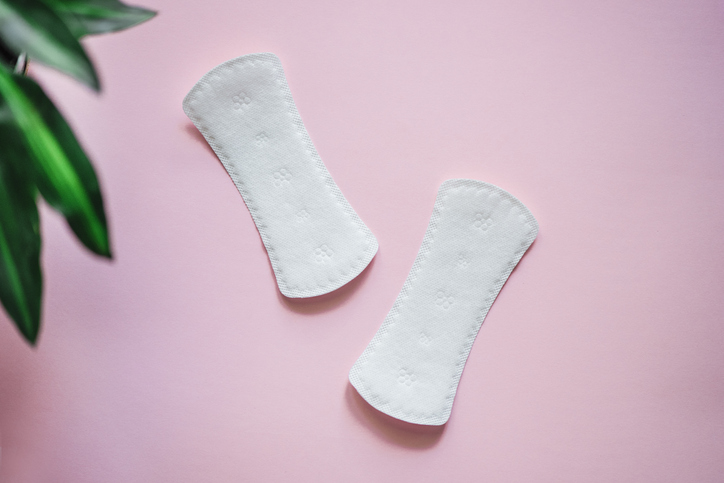 Sanitary pad on pink background