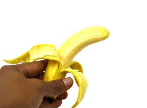 Close-Up Of Woman Holding A Banana