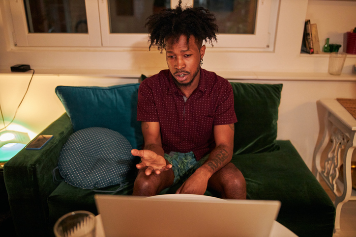 Young African American man talking over a video call with a friend