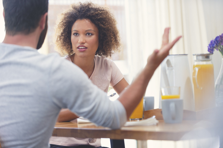 Couple fighting at the breakfast table.