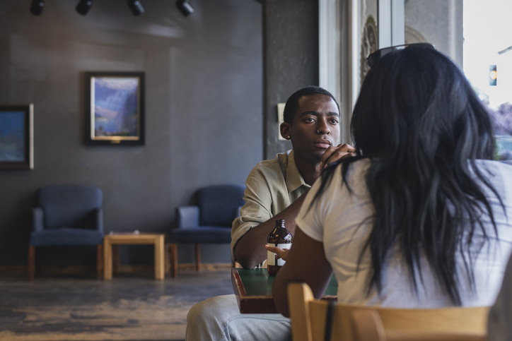 Two people having discussion in cafe