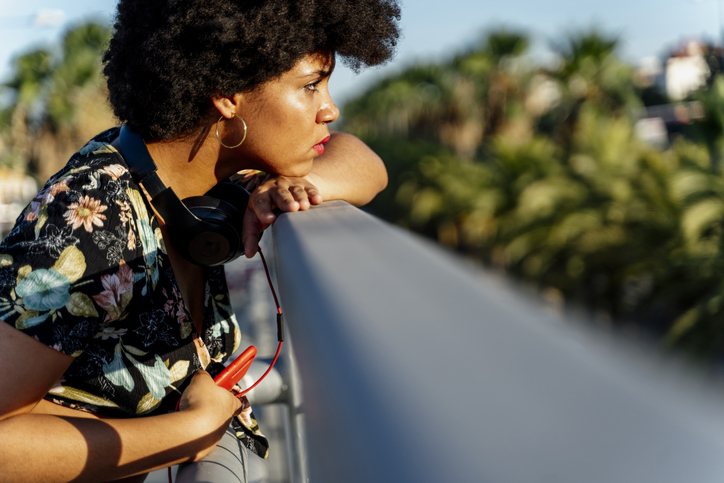 Female Afro-American with smartphone and headphones
