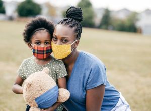 Outdoor Portrait of Mother and 5 y.o daughter wearing mask