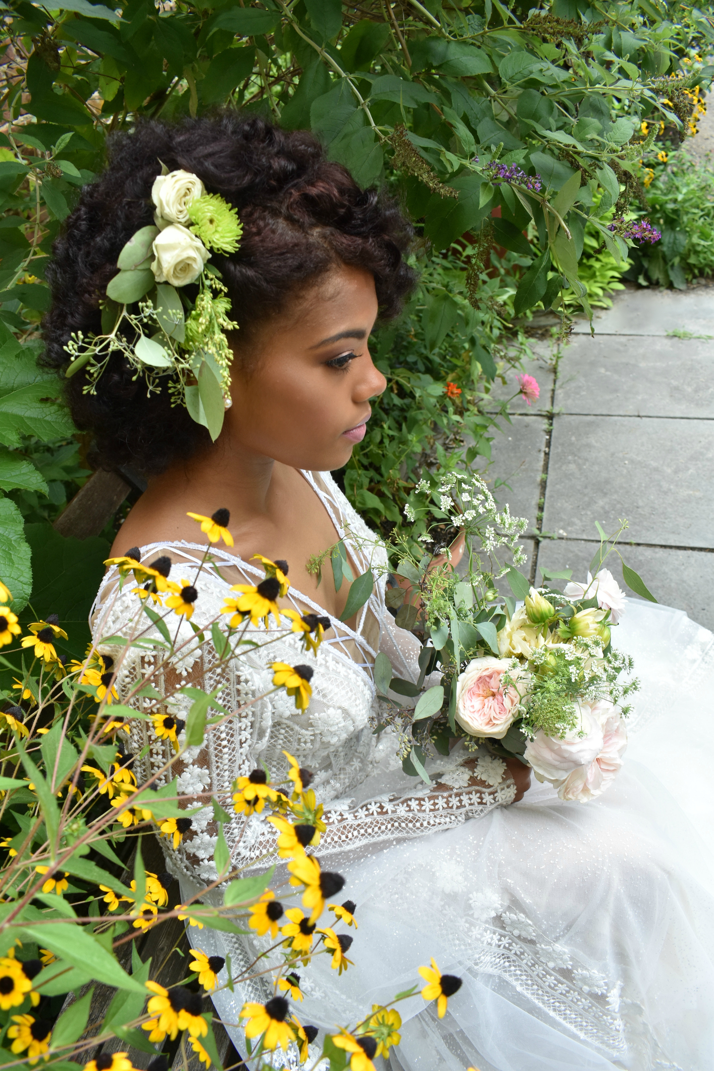 Young Woman With Bouquet Sitting By Plants