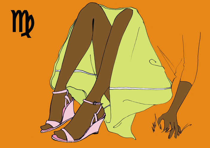 Lower body of Virgo woman sitting on floor