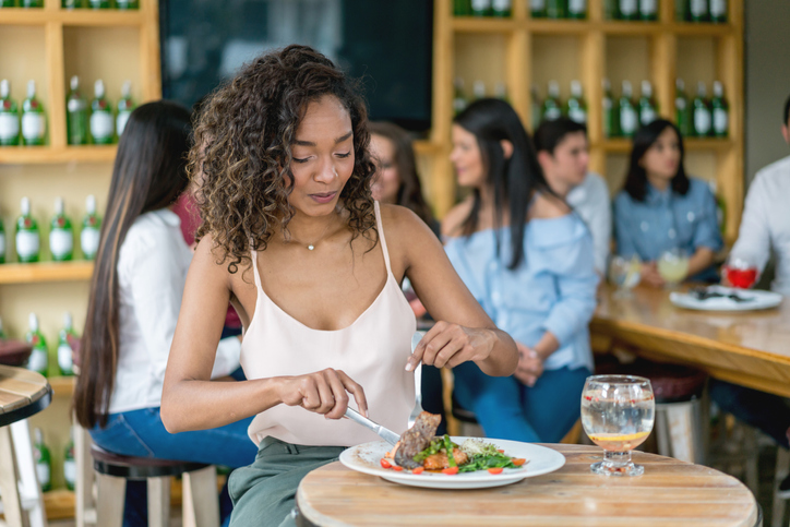 Beautiful woman eating at a restaurant