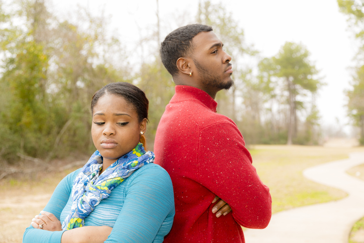 Conflict, arguement between African descent couple. Sadness, despair, anger.
