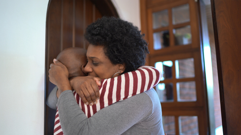 Daughter visiting mother at her home