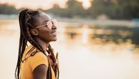 Young woman is relaxing by the river