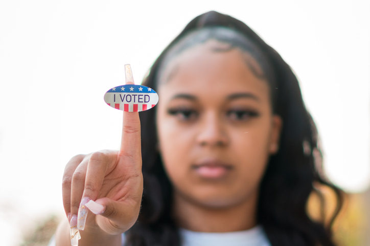 Young woman holds up 