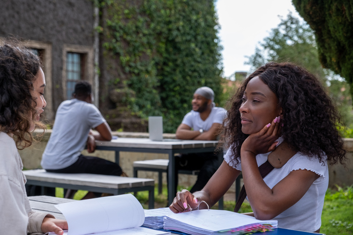 African college students on campus studying