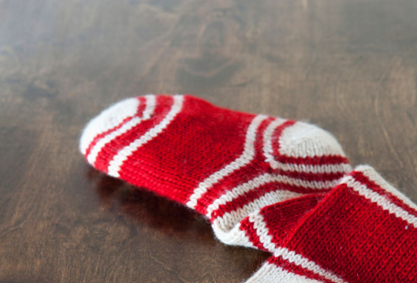 Christmas stocking with airline tickets and cash