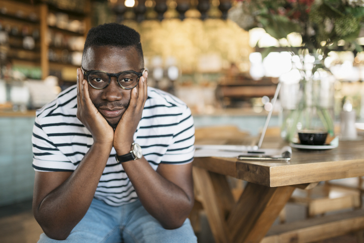 Portrait of an African American man losing a job