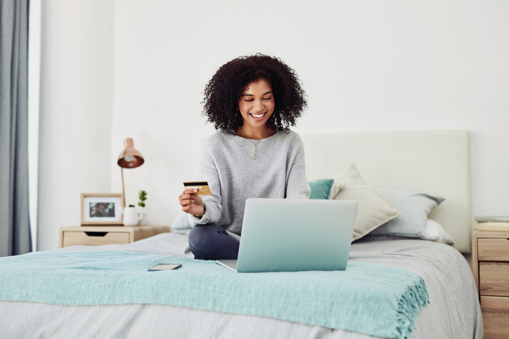 Black Woman Shops Online From Bed