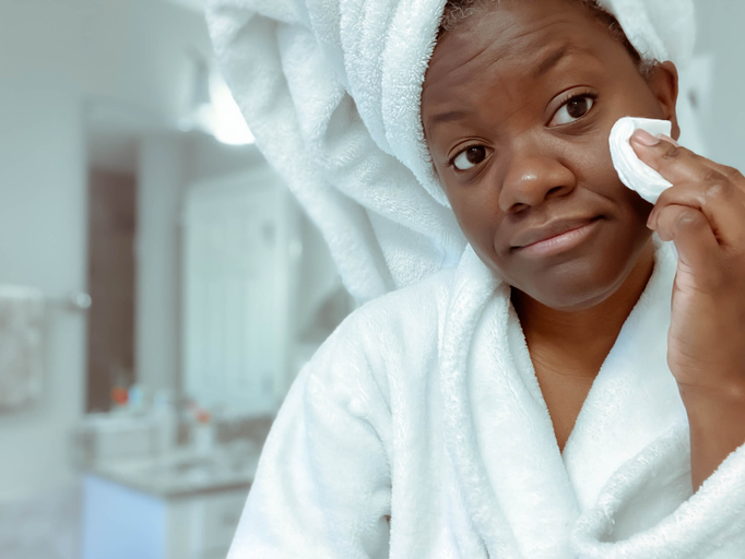 Woman Applies Toner to Face After Morning Shower