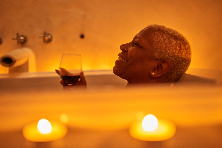 Mature woman relaxes in bath