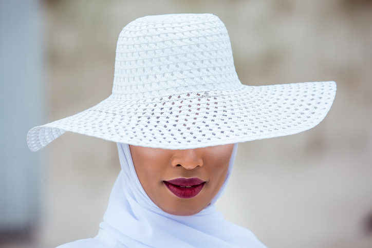Headshot of a Beautiful Muslim Woman wearing white hijab in the summer