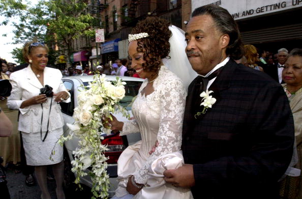 The Rev. Al Sharpton escorts his wife, Kathy Jordan Sharpton