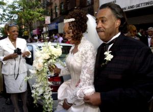 The Rev. Al Sharpton escorts his wife, Kathy Jordan Sharpton