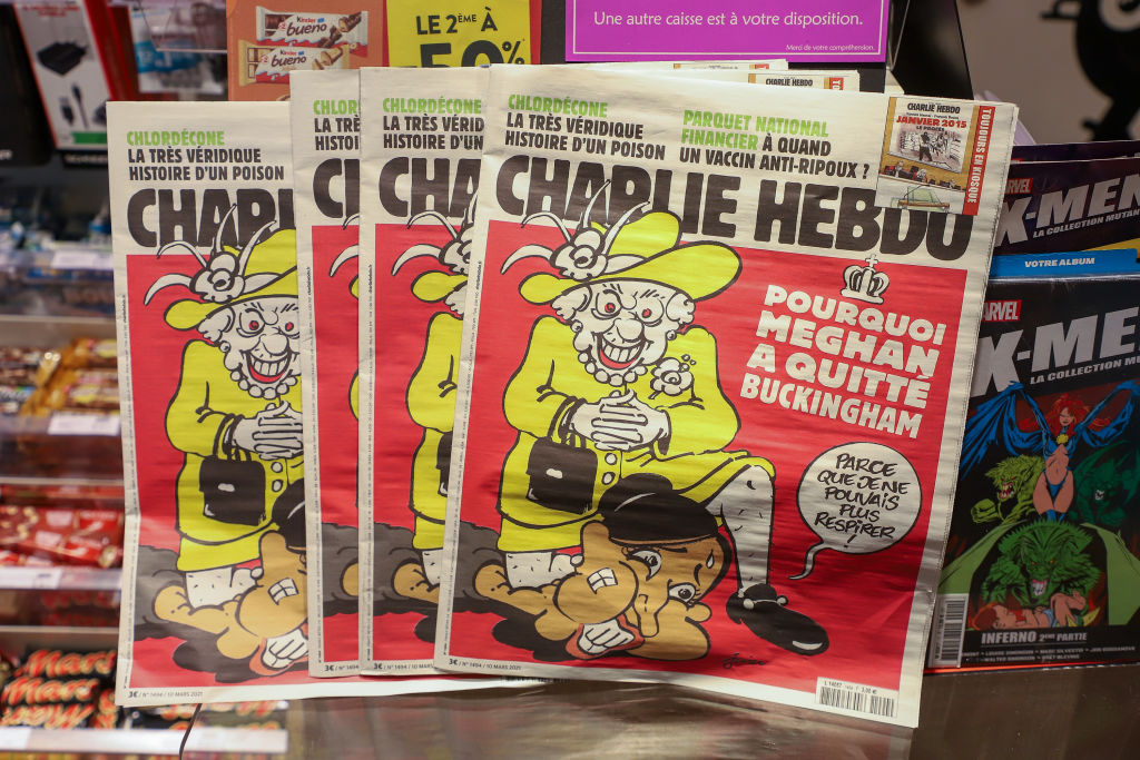 French Satirical Weekly Charlie Hebdo's Edition Displays A Cover With Queen Elizabeth kneeling on Meghan Markle's neck