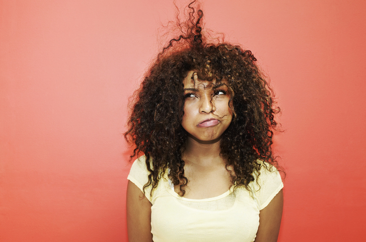 Young Woman Having Bad Hair Day