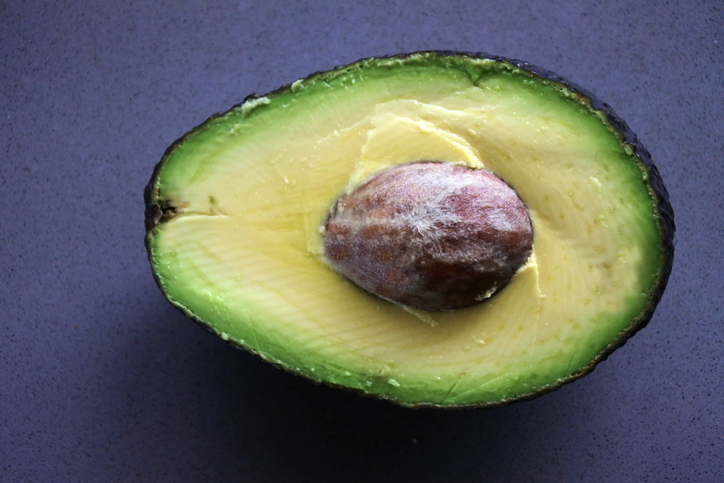 Fresh bright green half avocado tropical fruit