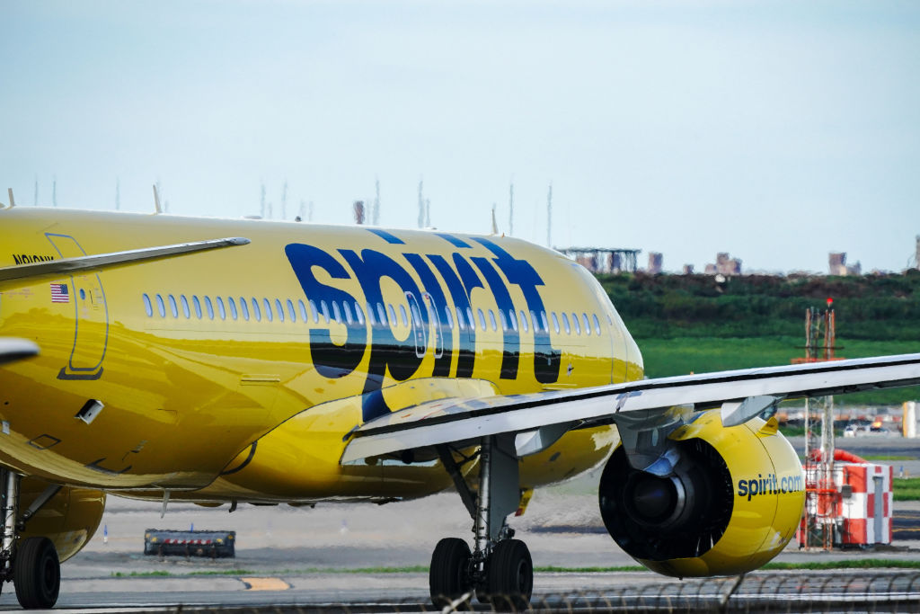A Spirit Airlines aircraft takes off at La Guardia Airport...