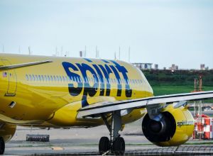 A Spirit Airlines aircraft takes off at La Guardia Airport...