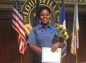 Breonna Taylor Smiles In Front Of A Louisville Department Agency