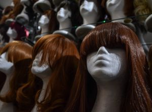 Close-Up Of Wigs On Mannequins In Store