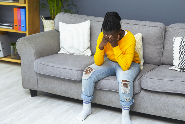 Upset beautiful teenager at home
