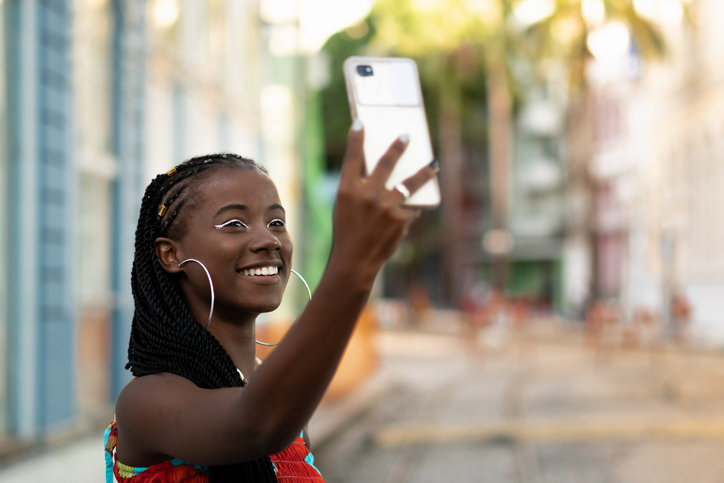 Beautiful afro woman taking selfie