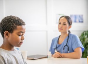 Preteen Discussing Depression with His Doctor