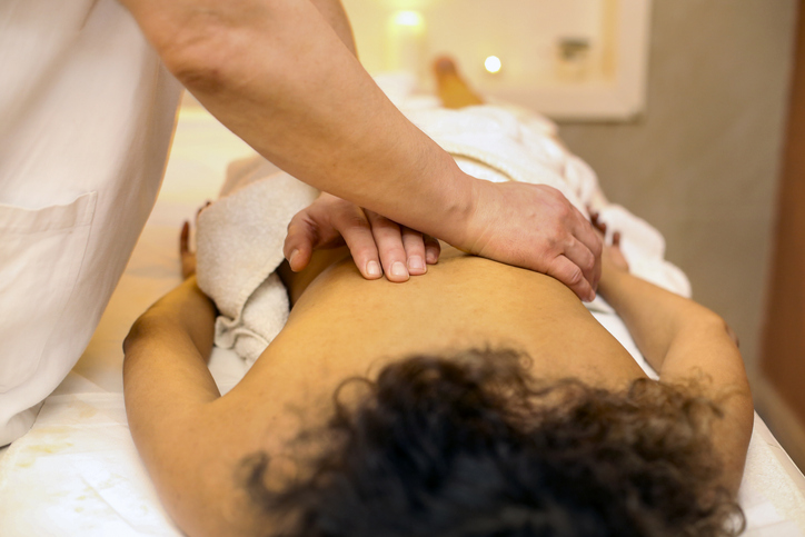 Young woman having a back massage