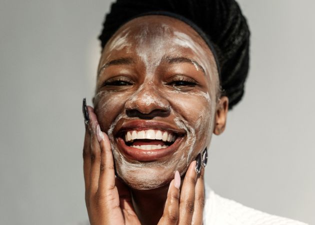 Portrait of a smiling woman with a face mask