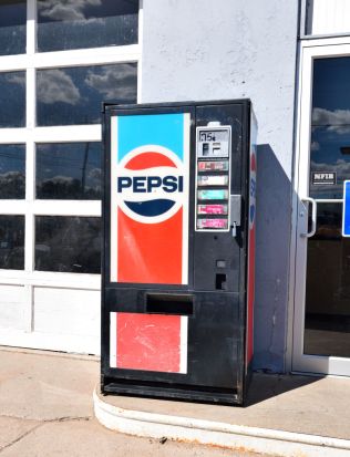 Vintage Pepsi Cola Machine sits outside a service station in a small northeastern Colorado town