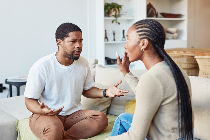 Shot of a young couple having a disagreement at home