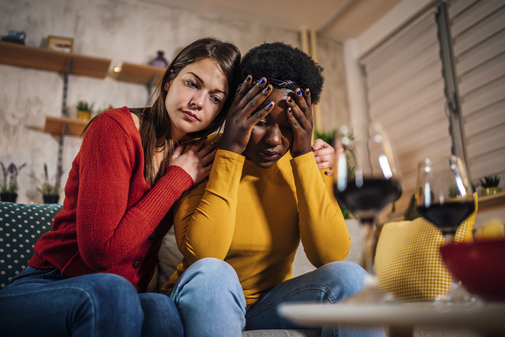 Woman support upset female friend