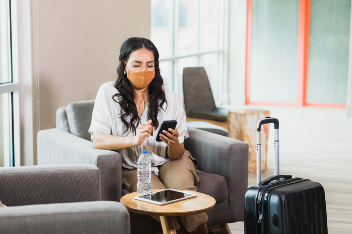 Businesswoman uses smartphone to check email