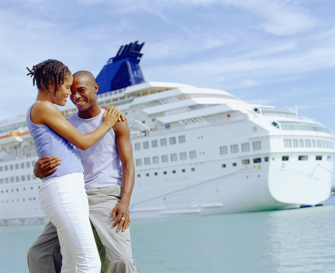 Close-up of a young couple embracing each other in front of a cruise ship, Bermuda