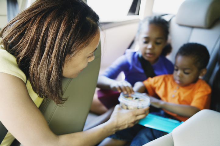 Mother and kids in car on a road trip