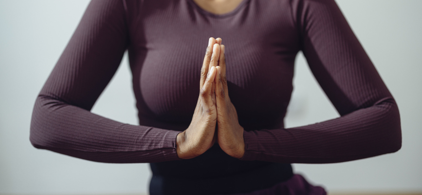 Anonymous Woman Meditating in a Prayer Pose