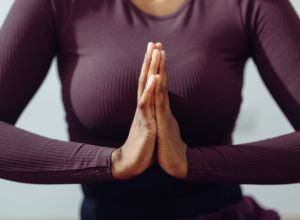 Anonymous Woman Meditating in a Prayer Pose