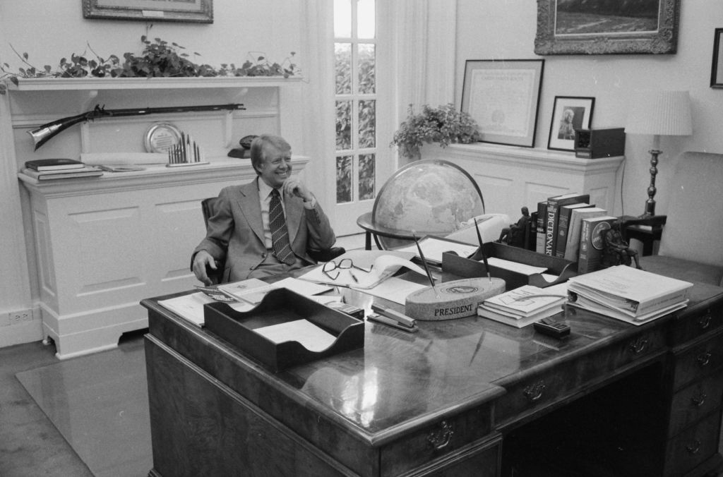 Jimmy Carter at his desk in his private study ca. 1 July 1977