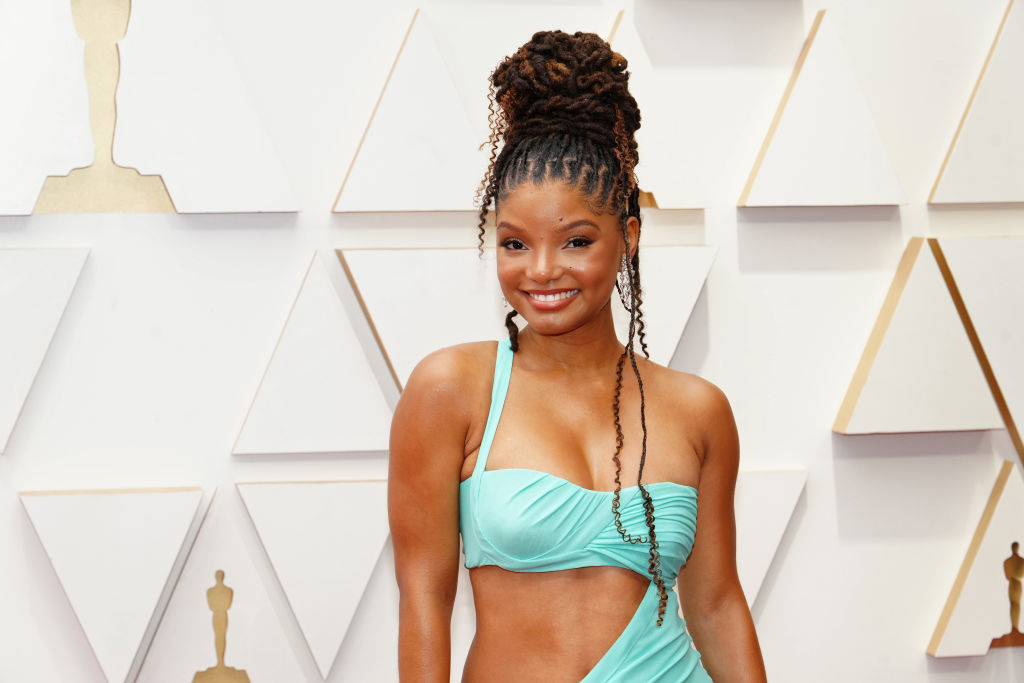 Halle Bailey poses on the red carpet at the 94th Annual Academy Awards.