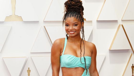 Halle Bailey poses on the red carpet at the 94th Annual Academy Awards.