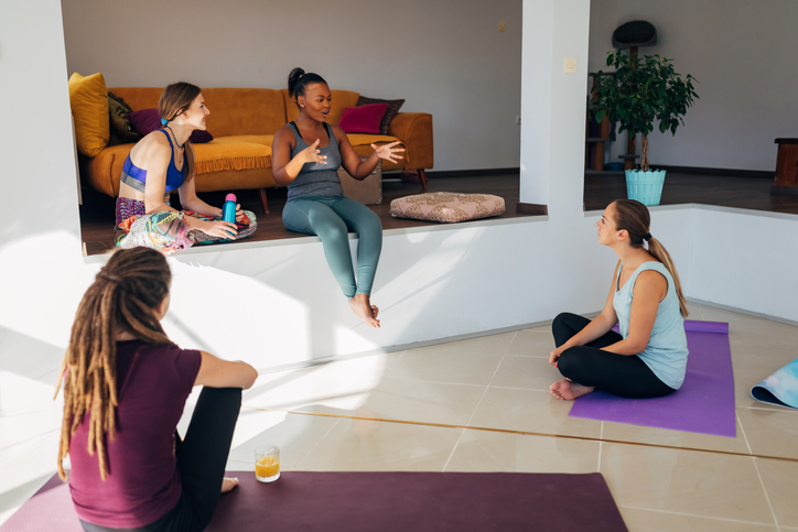 A black woman shares her impressions after her first yoga practice with her friends and yoga instructor