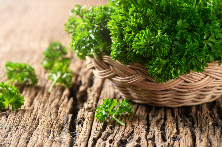 Close-Up Of Parsley Leaves In Basket On Table