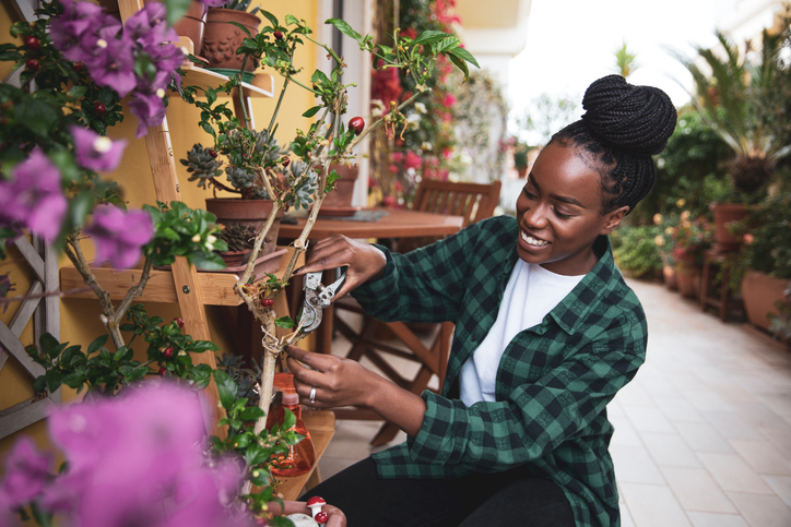 Woman gardening her own rooftop garden